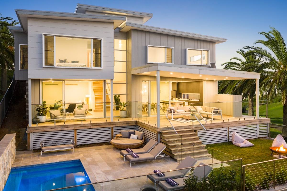 A stunning Kiama, NSW home with a pool, large deck, and open-plan living, built by a Lime Building Group.