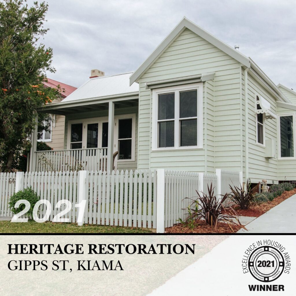 Restored heritage cottage in Kiama with white picket fence